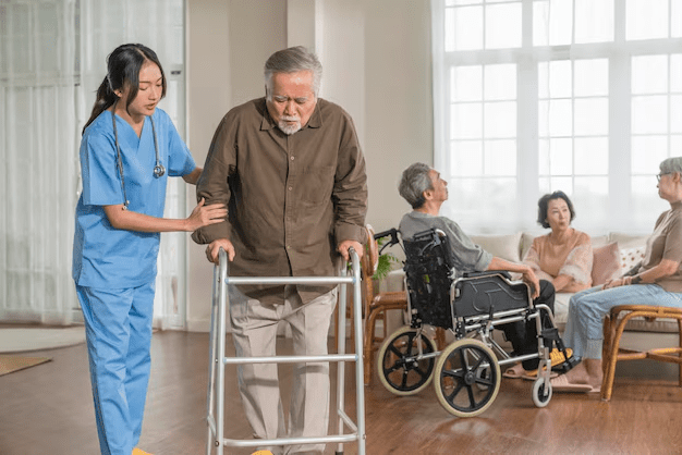 Caregiver assisting elderly man with mobility, home care jobs